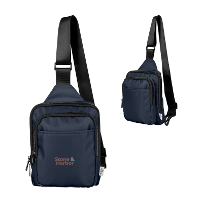 Image 19: Two navy blue Stone & Harbor sling bags, with black straps, are displayed against a white background
